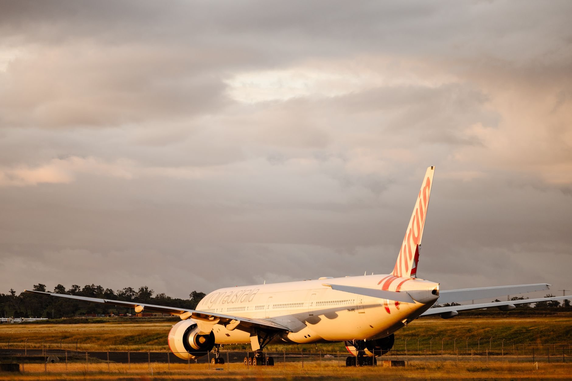 Private aircraft on tarmac at golden hour