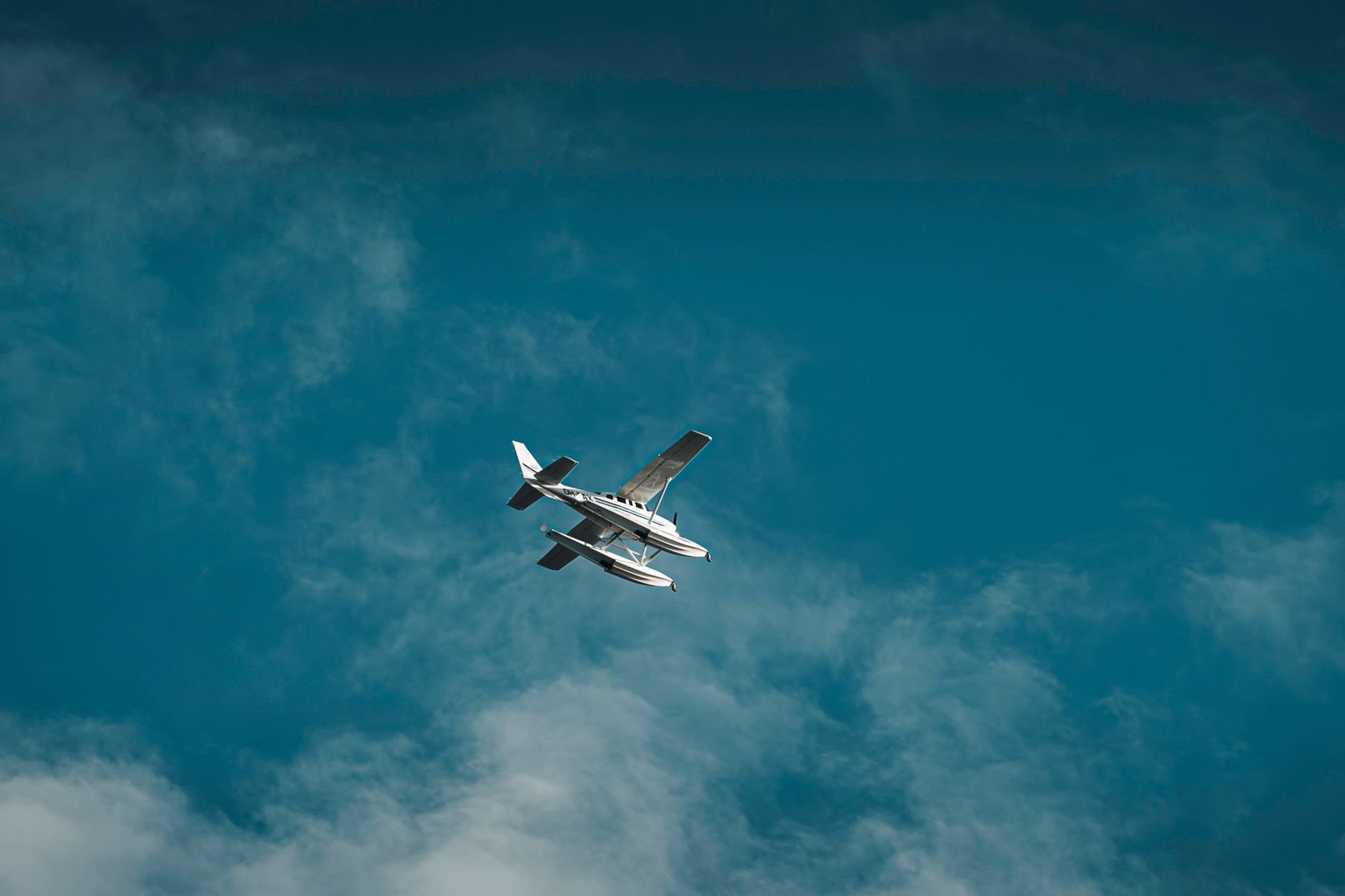 Seaplane soaring against a clear blue sky
